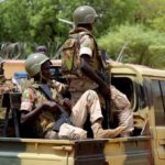 Members of the FAMA (Mali Armed Forces) patrol in the streets of Gao, on July 24, 2019, a day after suicide bombers in a vehicle painted with UN markings injured one French, several Estonian troops and two Malian civilians in an attack on an international peace-keeping base in Mali. - Malian authorities have struggled to improve security since France intervened in 2013 to drive back Islamic insurgents in the north. Around 4,000 French troops are deployed under Operation Barkhane alongside the MINUSMA peacekeeping force of around 15,000 soldiers and police. (Photo by Souleymane Ag Anara / AFP)