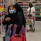 تورم - قیمت‌ها - گرانی Iranians shop for groceries at a hypermarket inside the Grand Bazaar (Iran Mall) in the western part of the capital Tehran, on June 20, 2021. - Iran's ultraconservatives hailed the election victory of their candidate Ebrahim Raisi, after Washington charged the vote was unfair and Tehran's arch-foe Israel labelled him the "most extremist" president yet.